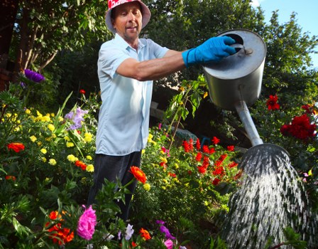Volunteers sorting garden waste into recycling streams